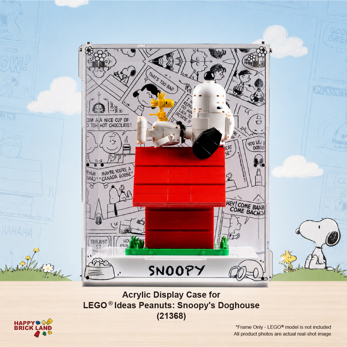 LEGO Ideas Peanuts: Snoopy's Doghouse acrylic display case (21368) shown with the assembled toy inside. The clear rectangular case features a white printed background with black comic-style drawings and the word 'SNOOPY' at the bottom.