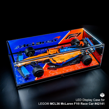 LEGO McLaren F1 race car model in an LED display case on a dark background