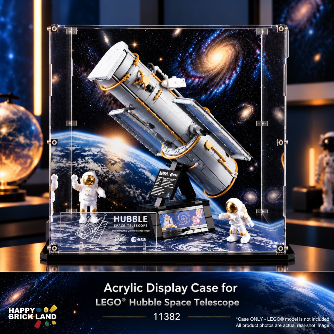 LEGO Hubble Space Telescope acrylic display case with astronaut figures, shown on a dark space-themed background. The case contains a detailed model of the Hubble telescope with Earth visible through the printed outer display panel.